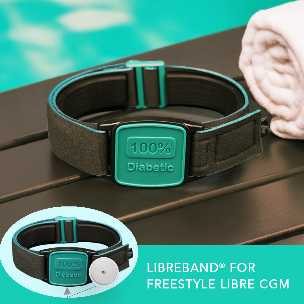 Libreband with 100% Diabetic design in teal, for Freestyle Libre CGM on a wooden surface with a pool in the background.