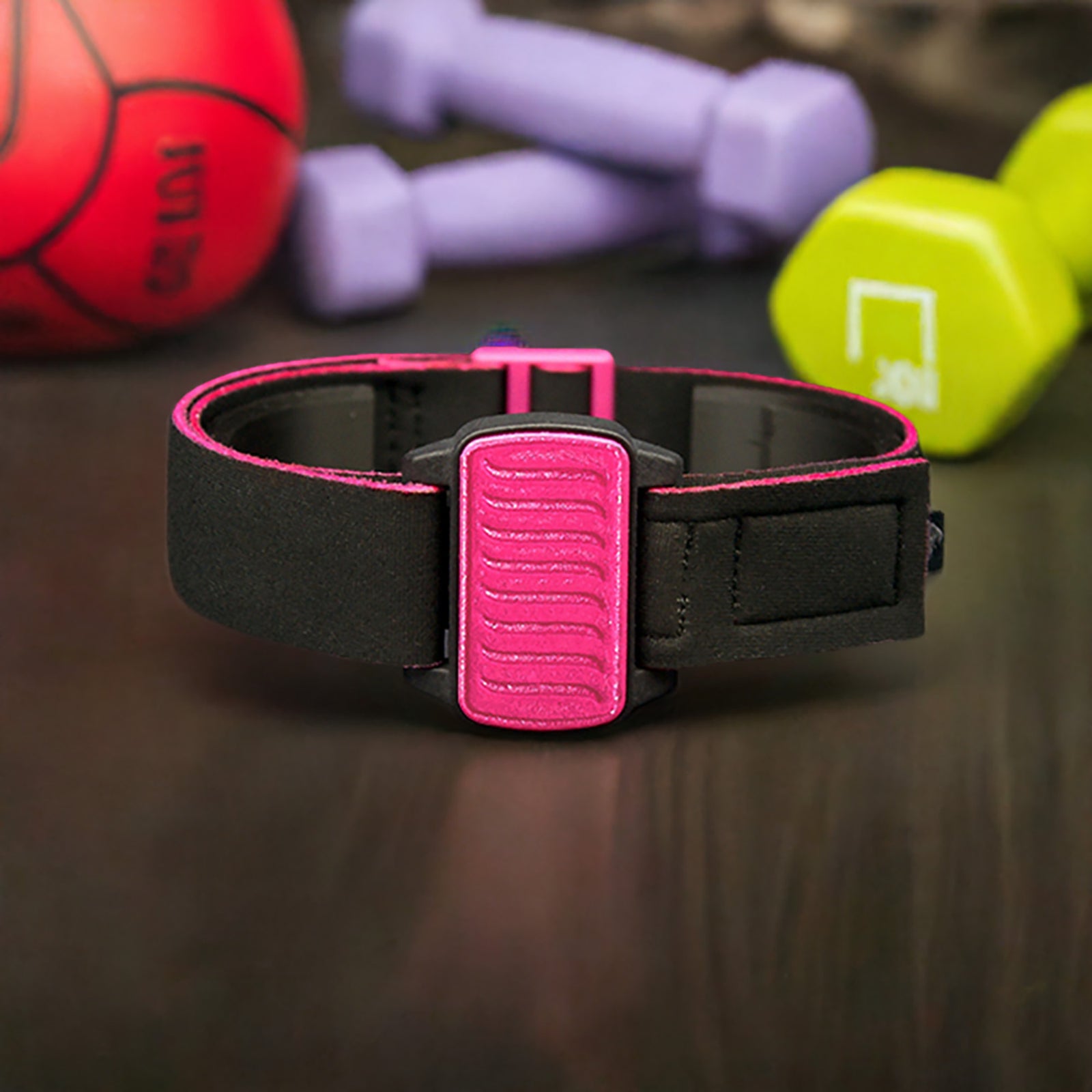 Dexband CGM armband for Dexcom G6 and ONE+ with magenta wave cover and water-resistant neoprene strap in gym setting