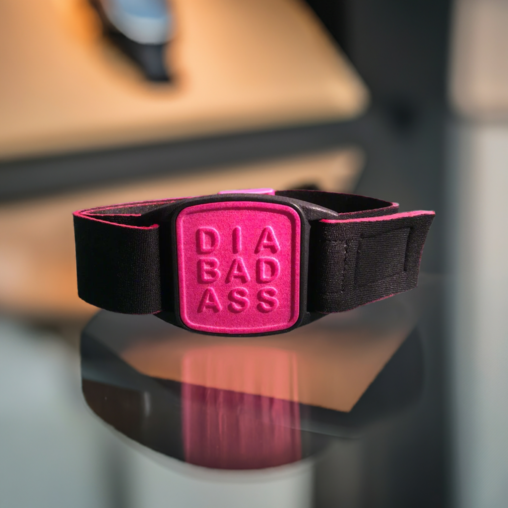 Dexband armband in magenta with DIABADASS cover. Shown with G7 CGM. LML3989, LML3996, LML4009, LML4986.