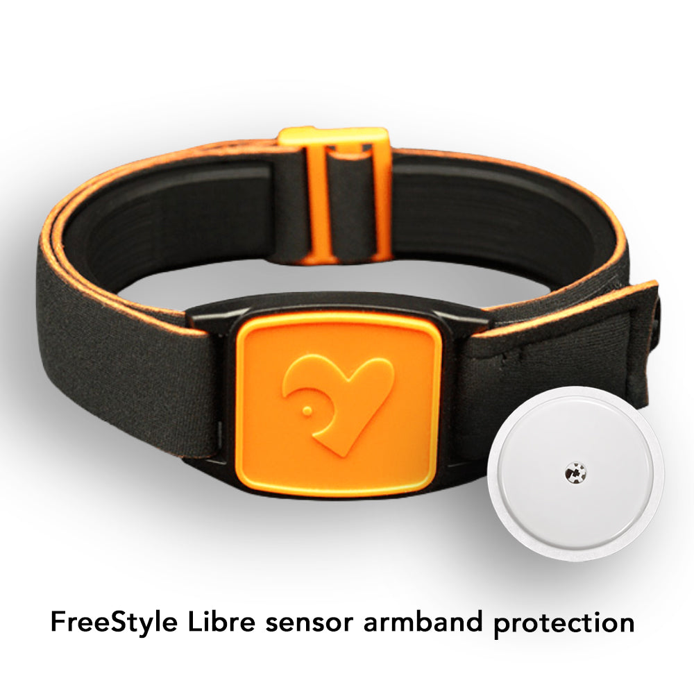 Black and orange Libreband armband for Freestyle Libre CGM on a dark wooden surface with pool background.