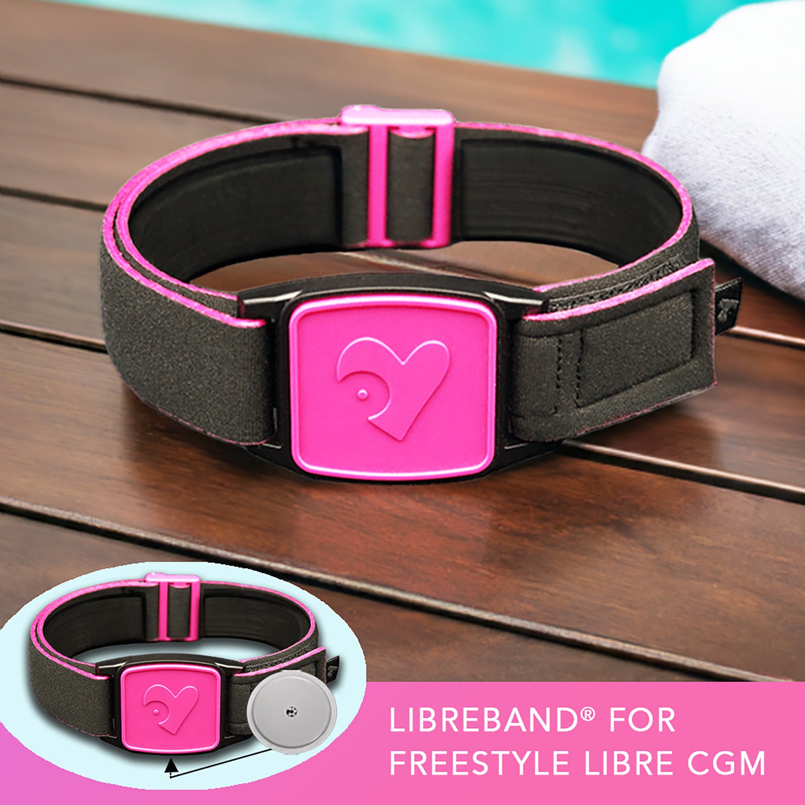 Libreband CGM armband for FreeStyle Libre 2 with magenta heart cover and water-resistant neoprene strap on wooden lounger in swimming pool setting. LML2388, LML2371, LML2920, LML4481.