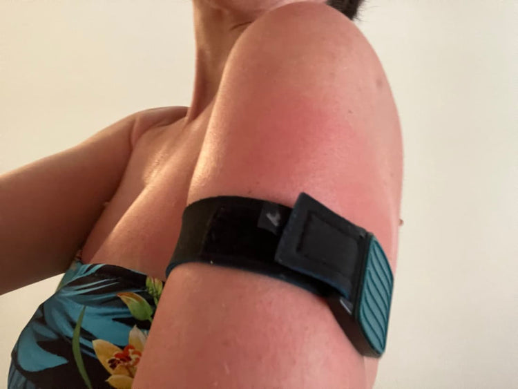 Libreband CGM armband for FreeStyle Libre with teal wave cover and black neoprene strap worn on upper arm, customer review photo by Elizabeth