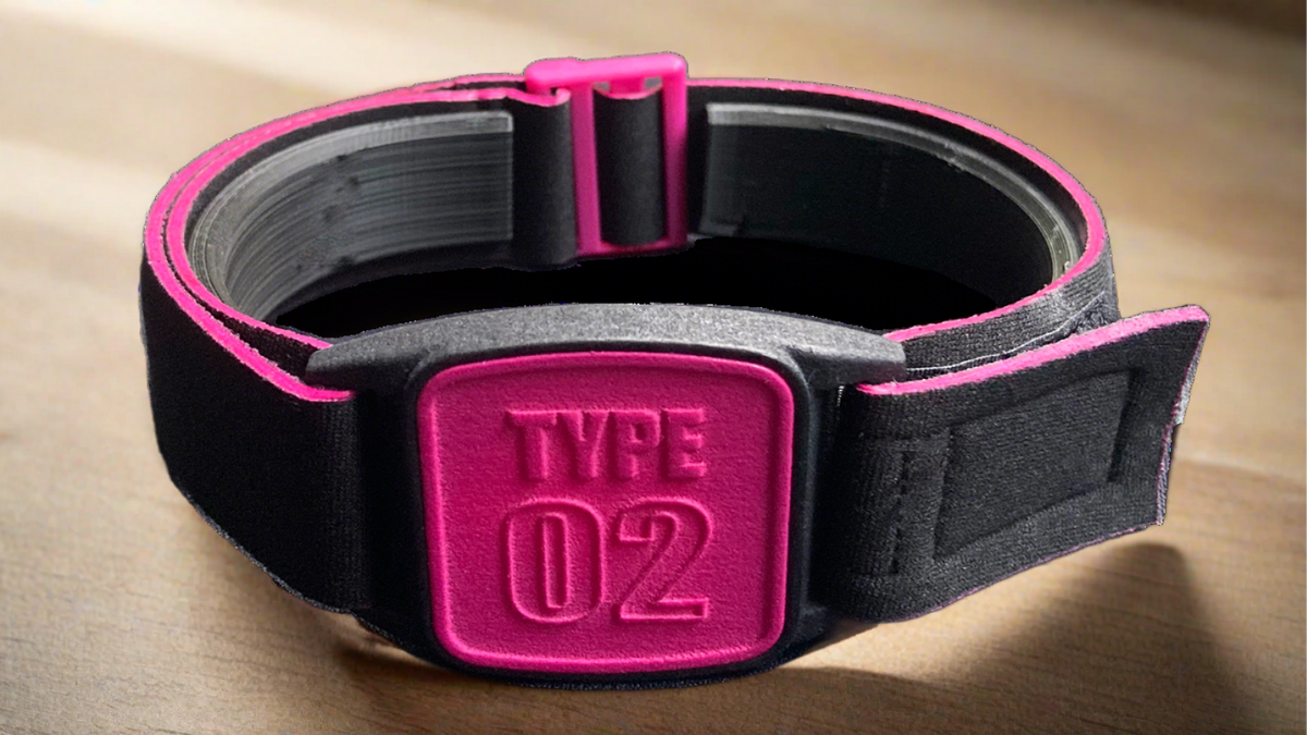 Libreband armband with Type 02 design cover in magenta. Black neoprene strap and magenta buckle.