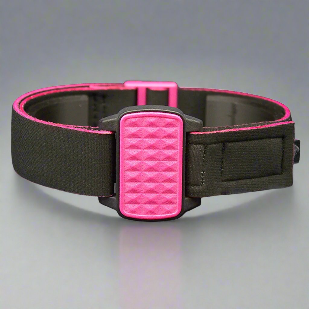 Dexband armband with magenta pyramids cover. Black strap edged in coordinating magenta.