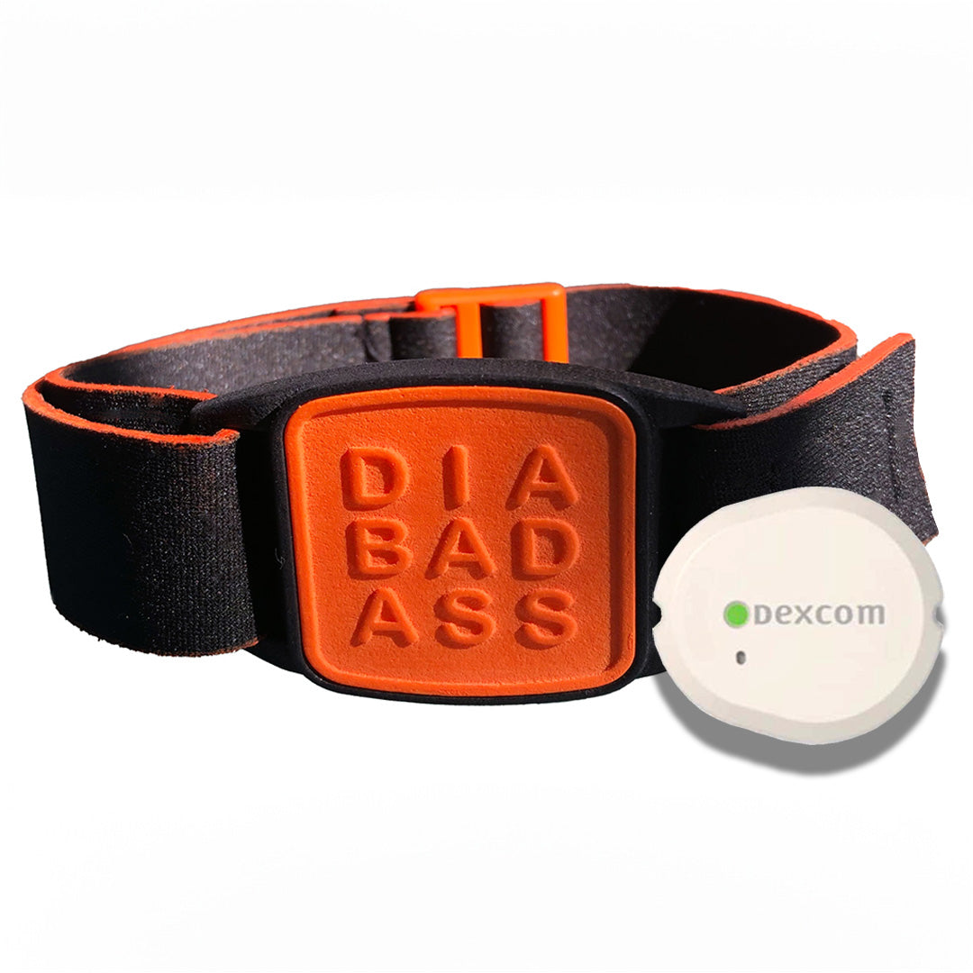 Dexband armband in orange with DIABADASS cover. Shown with Dexcom G7 CGM.