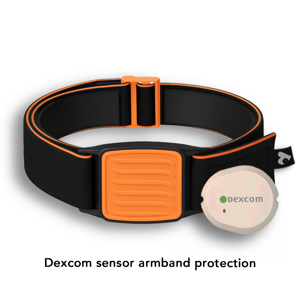 Dexband Armband for Dexcom G7, black strap with orange wave design cover.  Shown next to towel with swimming pool in background.