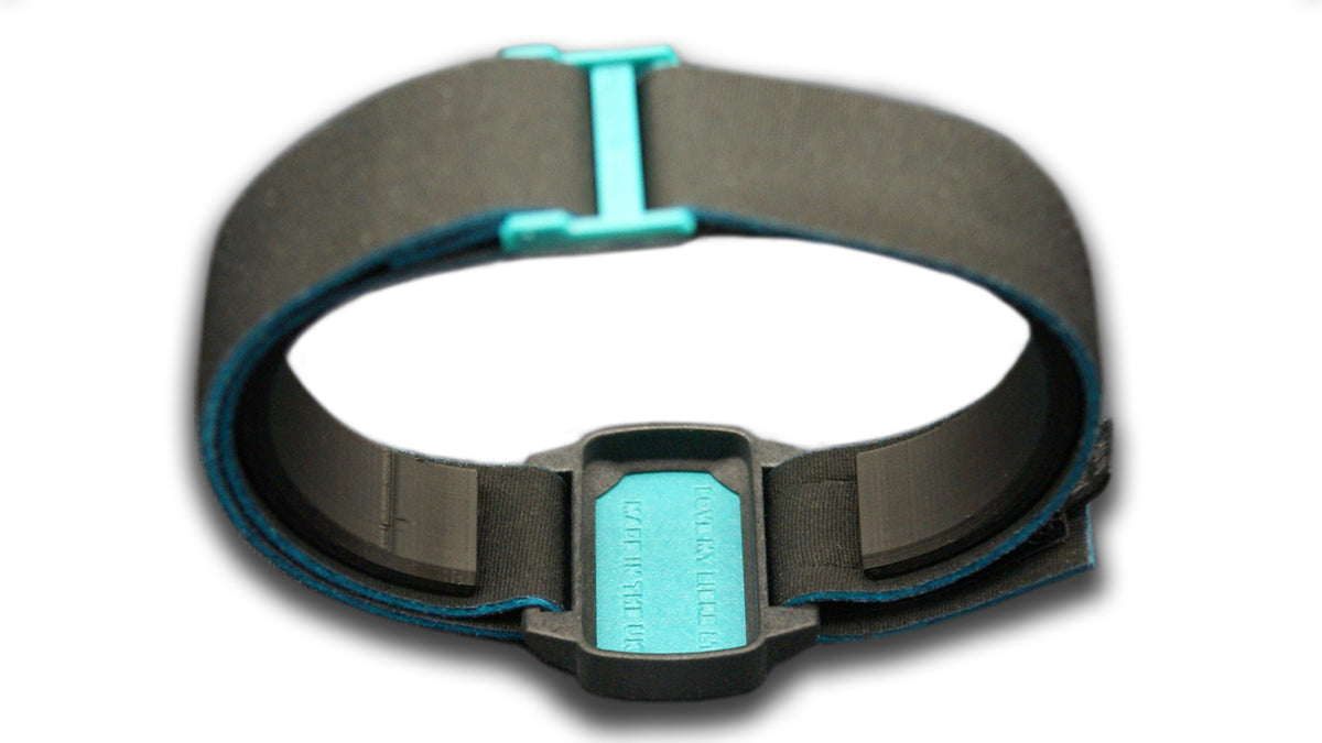 Reverse image of Dexband with black strap and teal cover for Dexcom G6 sensor.