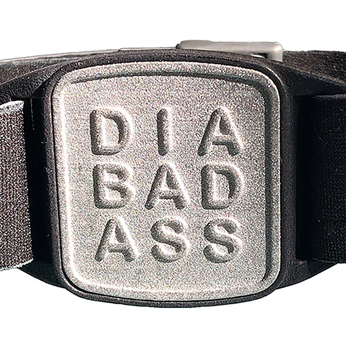 CGM armband close-up of pewter cover and black neoprene strap, compatible with Dexcom G7 and ONE+ sensors, showing Diabadass design detail.