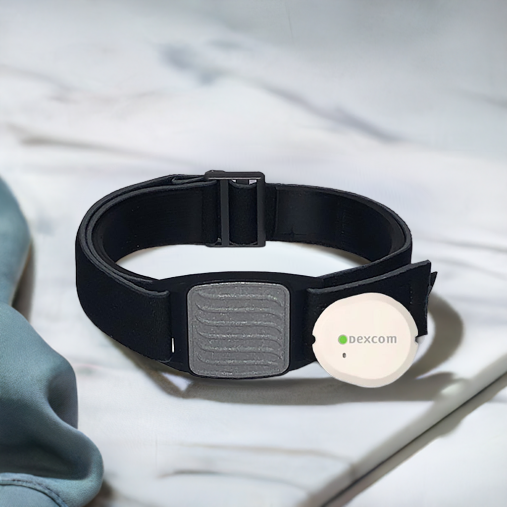 Dexband armband for Dexcom G7 CGM. Pewter cover with Wave design. Shown with Dexcom G7 sensor.