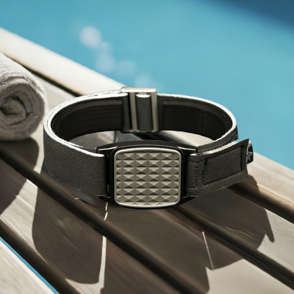 Libreband armband with pewter pyramids design. Shown with swimming pool background.