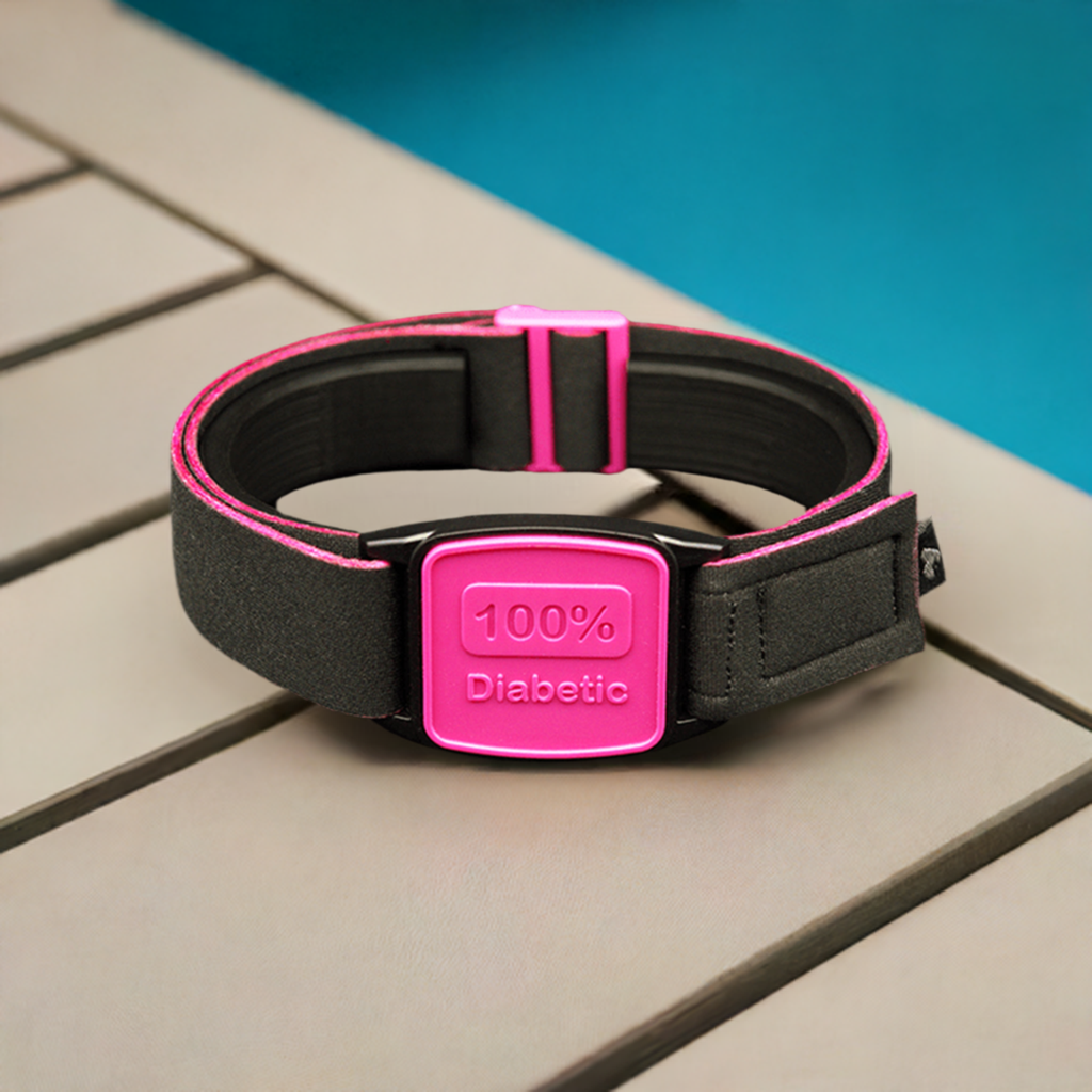 Libreband Armband for Freestyle Libre 1 &amp; 2. Magenta cover with 100% Diabetic design. Swimming pool in background.