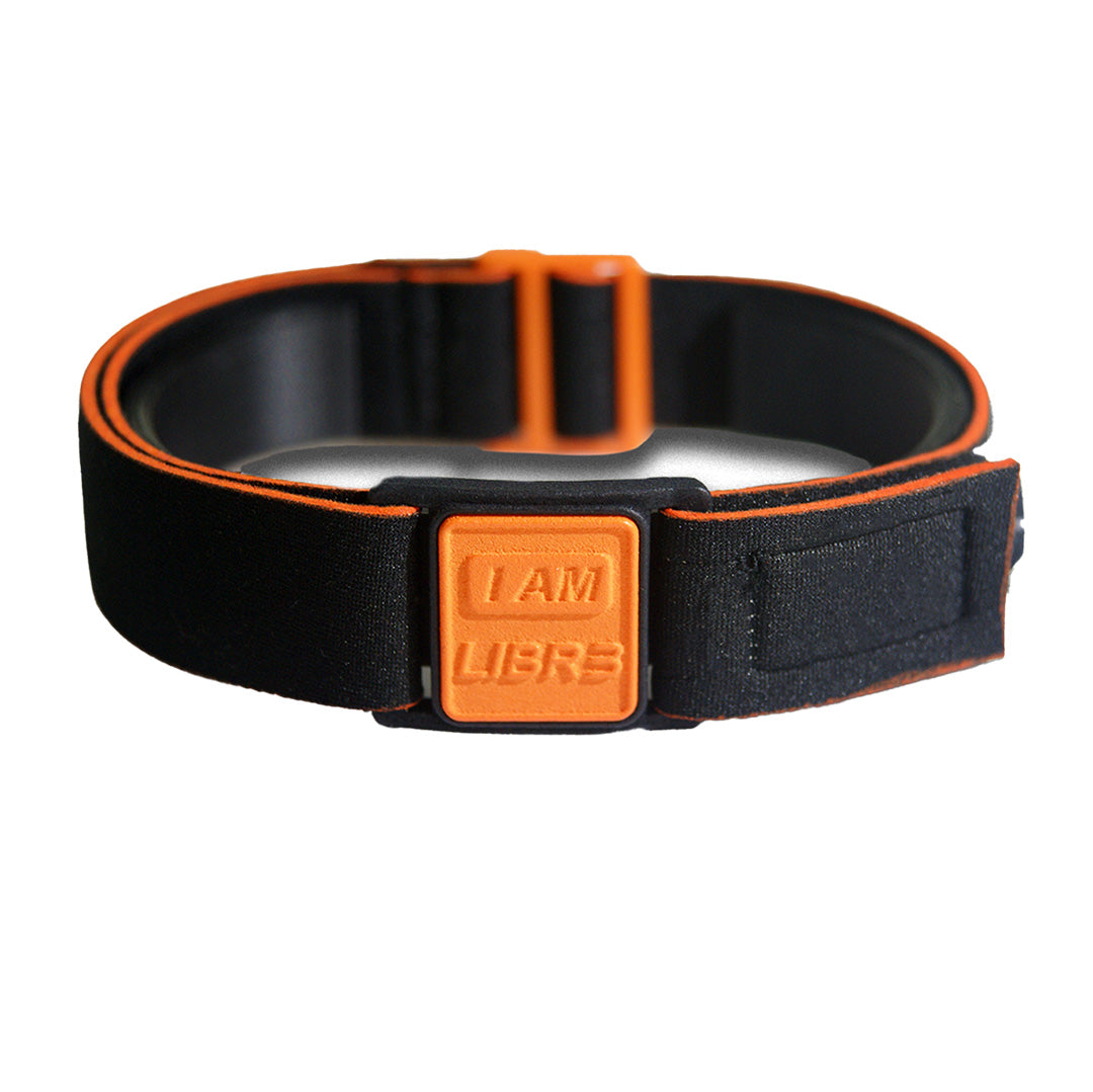 Libreband Armband for Freestyle Libre 3. Orange cover with LIBR3 design.