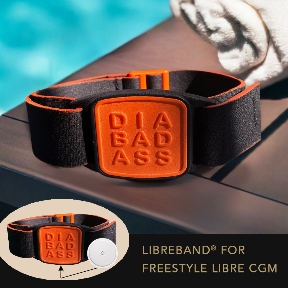 Libreband armband in orange with Diabadass cover and black neoprene strap.