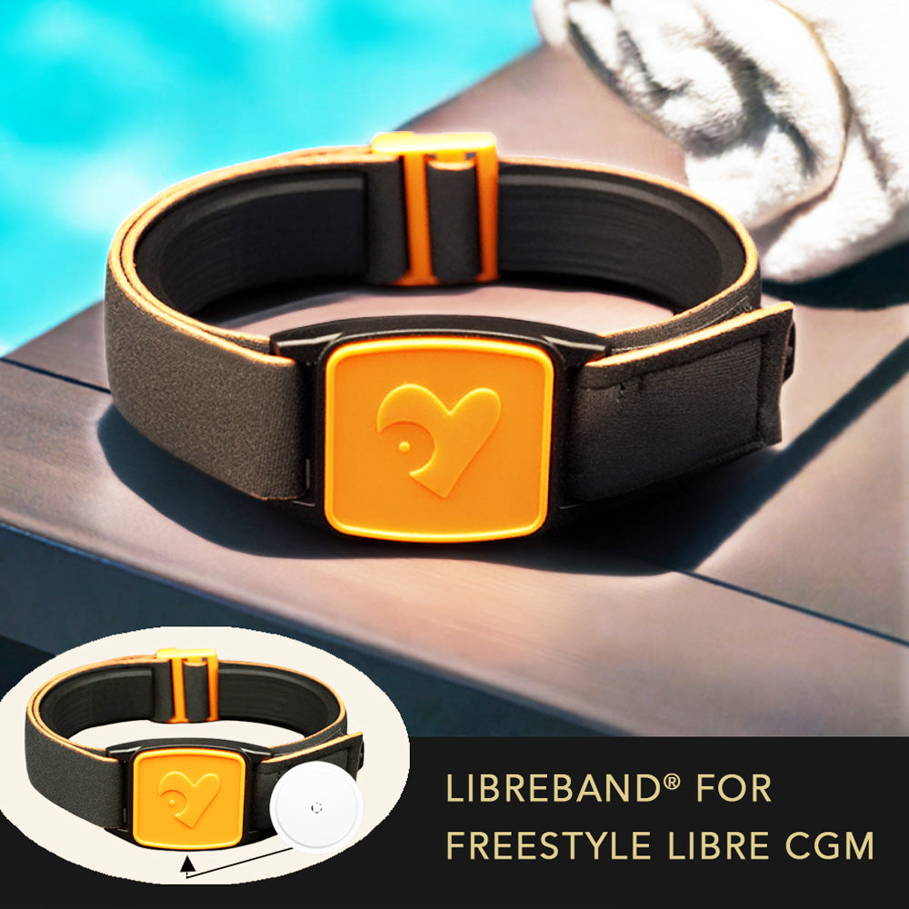 Libreband CGM armband for FreeStyle Libre 2 with orange heart cover and water-resistant neoprene strap on wooden lounger in swimming pool setting. Inset of armband alongside sensor. LML4559, LML2937, LML2272, LML2289.