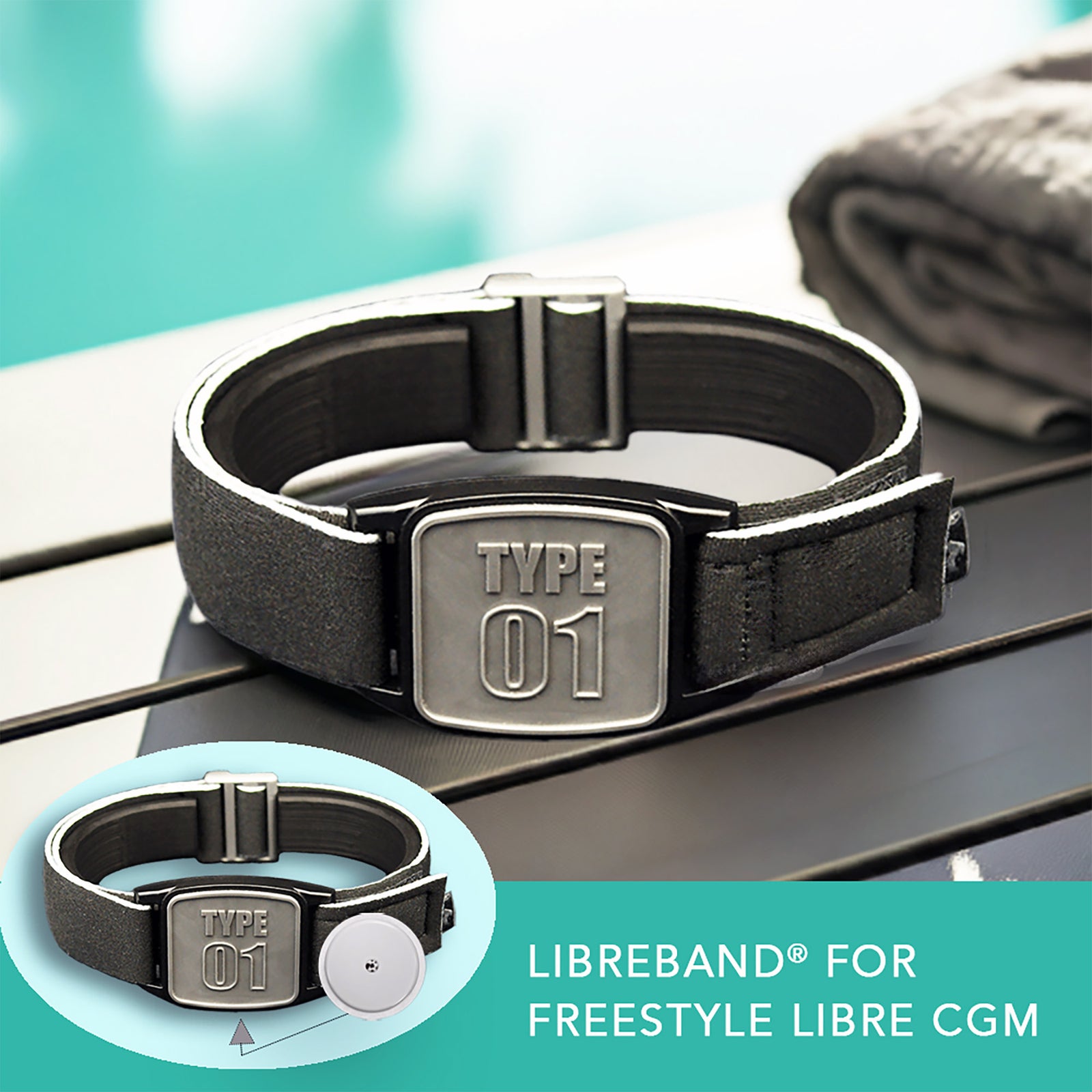 Libreband CGM armband for FreeStyle Libre 2 with pewter Type 01 cover and water-resistant neoprene strap on wooden lounger in swimming pool setting. LML4641, LML3026, LML2517, LML2524.