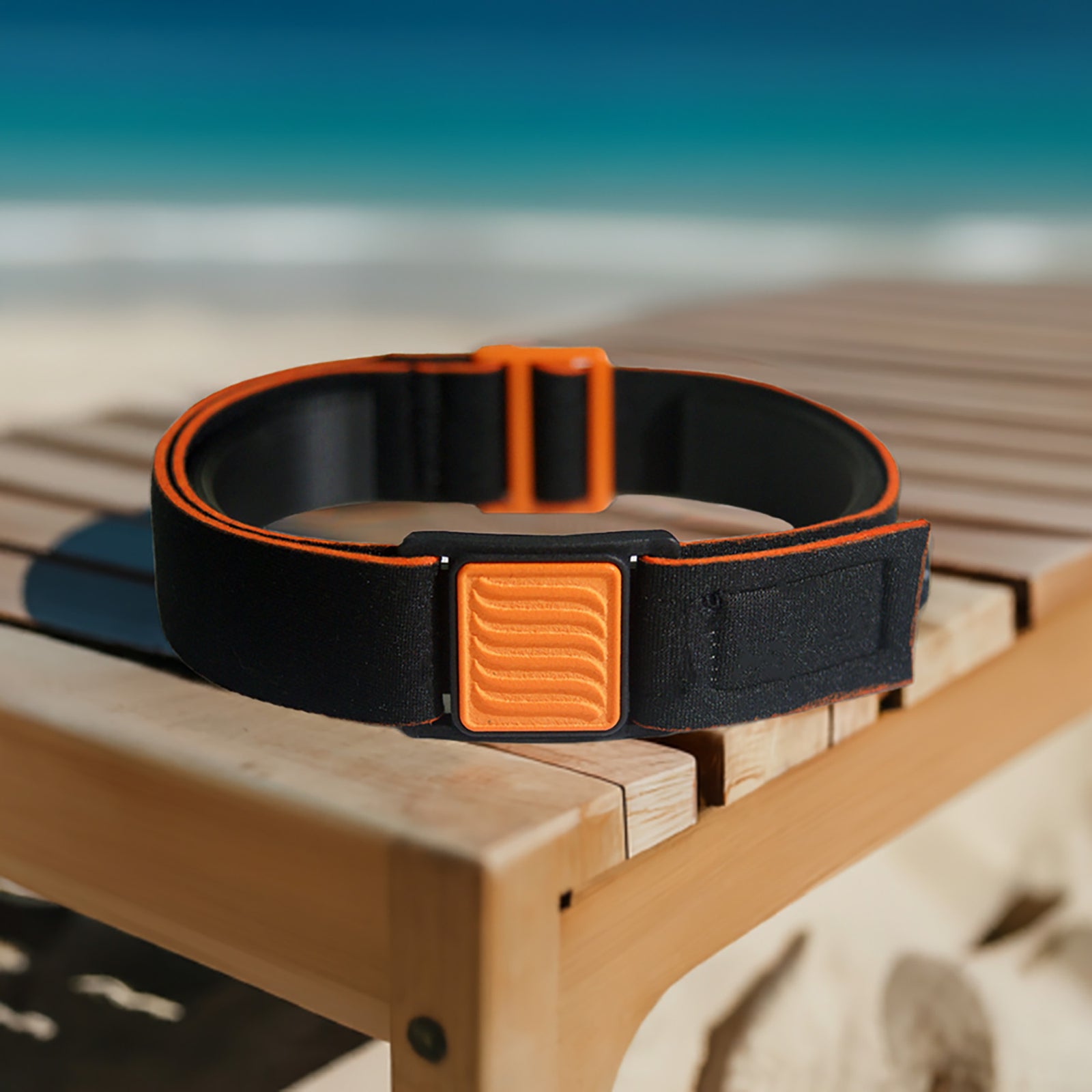 Libreband CGM armband for FreeStyle Libre 3 with orange wave cover and water-resistant neoprene strap on beach lounger