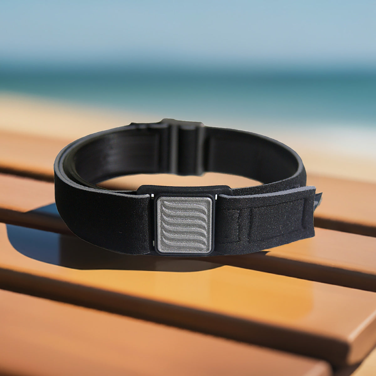 Libreband CGM armband for FreeStyle Libre 3 with pewter wave cover and water-resistant neoprene strap on beach lounger