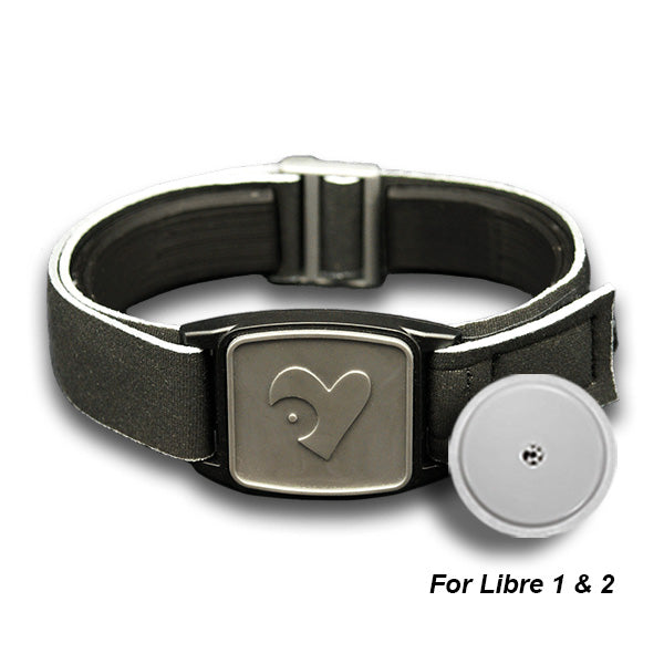 Libreband armband cover in pewter with heart design. Black strap edged in coordinating pewter. Shown with Freestyle Libre 2 sensor.